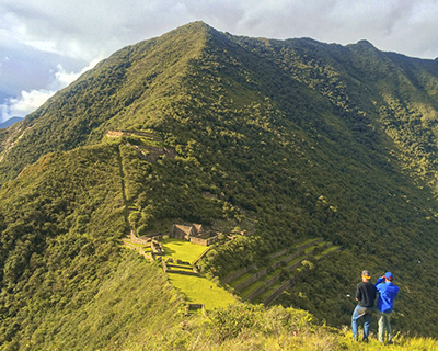 Two people taking panoramic photos of the Archaeological site of Choquequirao