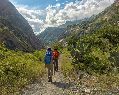 People walking in the middle of the roads to Choquequirao