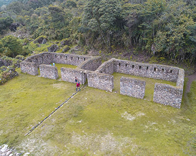 Group of trekker smiling for a picture in the middle of rainforest