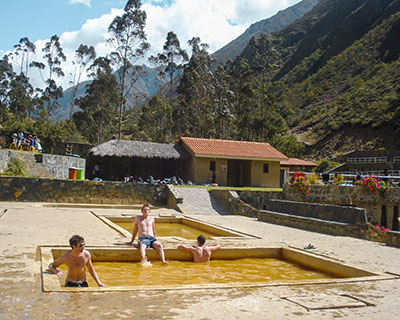 People enjoying the Lares hot springs in the morning