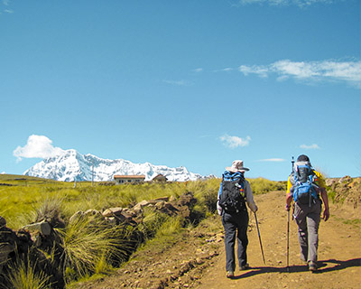 Friends walking in the morning towards the Ausangate mountain