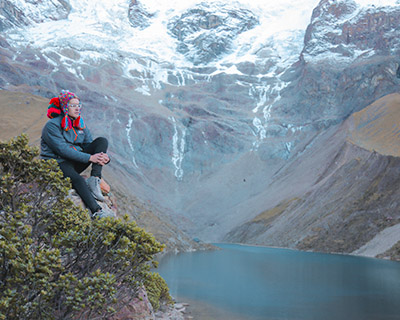 Relaxed man beside the Humantay Lake